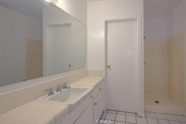 bathroom featuring a shower, tile patterned flooring, and vanity