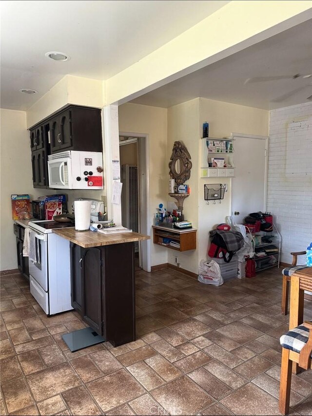 2922 Radnor Ave, Long Beach, CA 90815 - kitchen with baseboards, dark cabinets, and white appliances