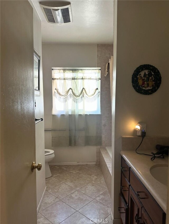 2922 Radnor Ave, Long Beach, CA 90815 - full bath with visible vents, tile patterned flooring, vanity, toilet, and tiled shower / bath