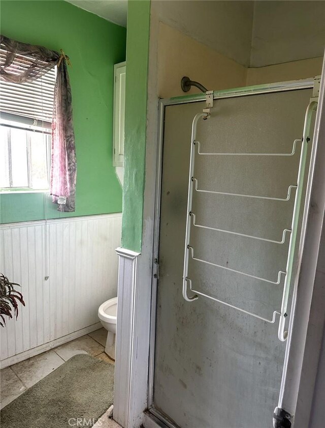 2922 Radnor Ave, Long Beach, CA 90815 - bathroom with toilet, tile patterned floors, wainscoting, and a stall shower