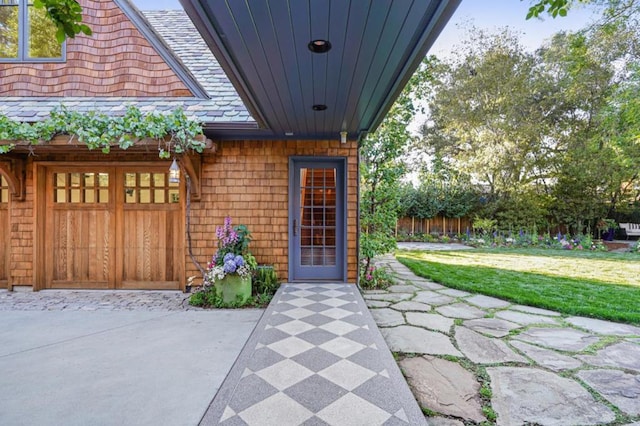 doorway to property with a lawn