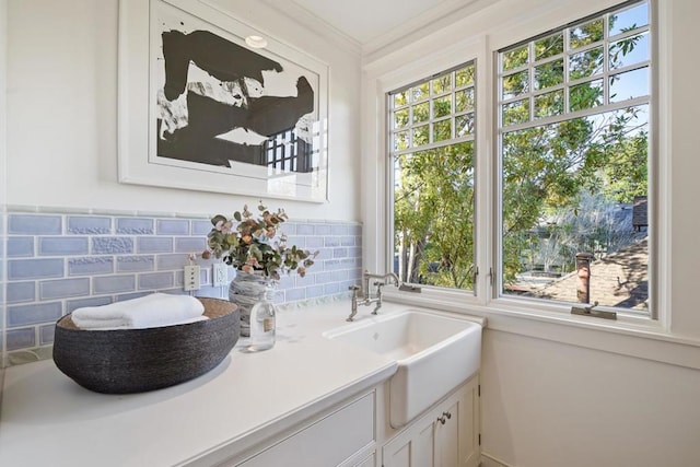 bathroom featuring vanity and ornamental molding