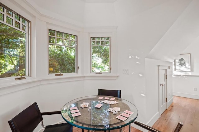 dining space with light hardwood / wood-style floors