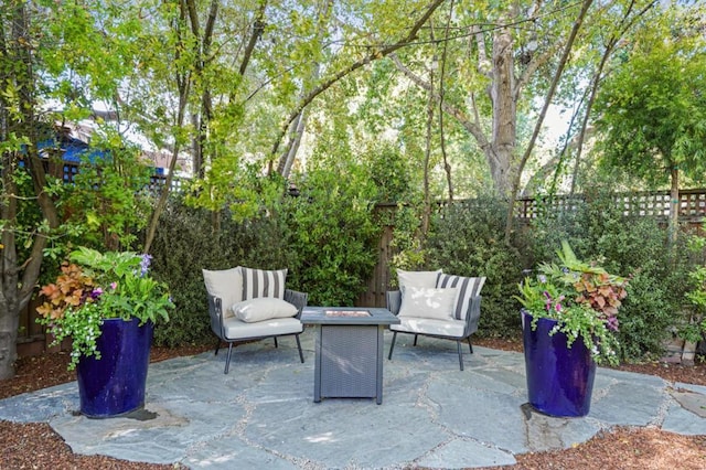 view of patio with a fire pit