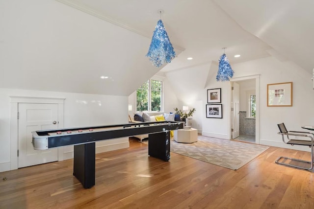 rec room with lofted ceiling and hardwood / wood-style floors