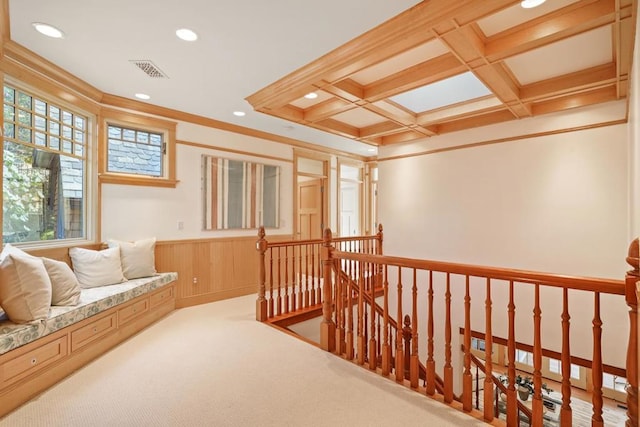 living area with light carpet, crown molding, coffered ceiling, and beamed ceiling