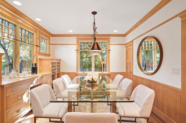 dining area featuring ornamental molding and hardwood / wood-style floors