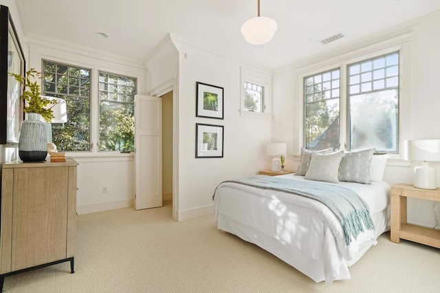 carpeted bedroom featuring crown molding