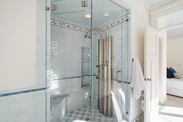 bathroom featuring tile walls and a shower with door