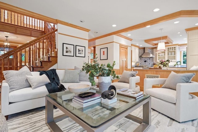 living room featuring a notable chandelier and crown molding