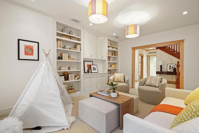 carpeted living room with built in shelves