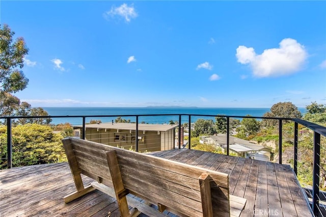 wooden terrace with a water view