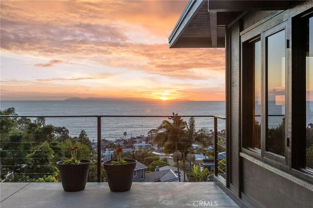 balcony at dusk with a water view