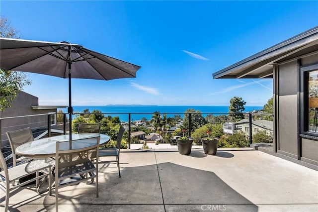 view of patio featuring a water view