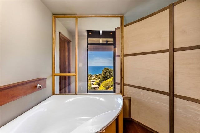 bathroom with a tub to relax in