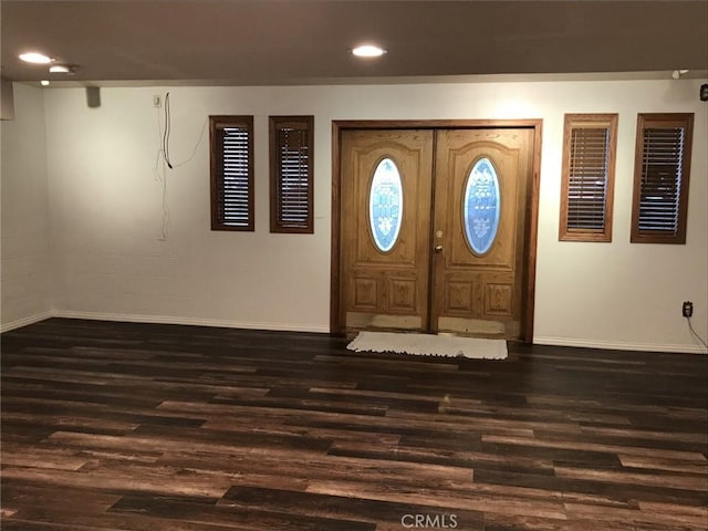 foyer entrance with dark hardwood / wood-style floors