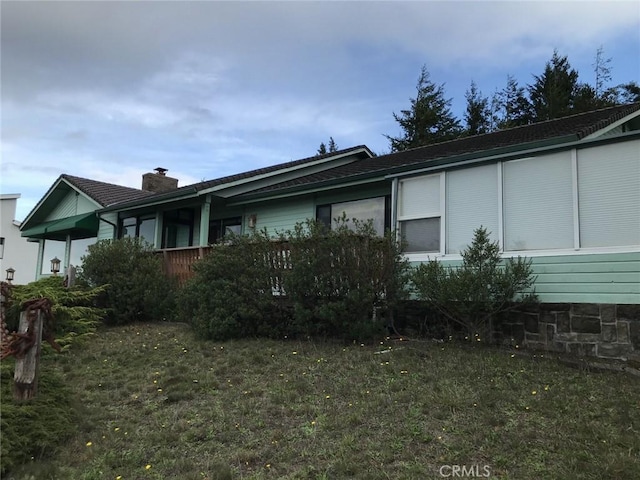 view of home's exterior featuring a yard