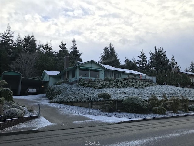 view of front of property with a carport