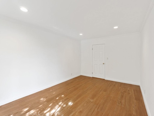 empty room with light hardwood / wood-style flooring