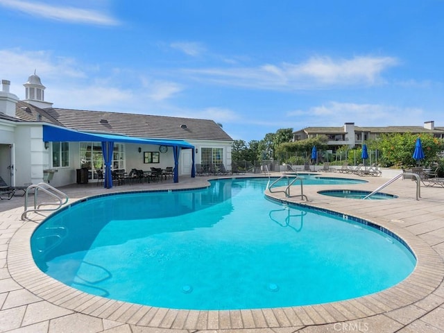 view of swimming pool featuring a patio area