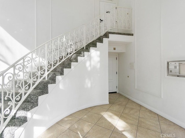 stairway featuring tile patterned floors