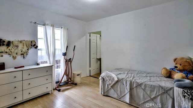 bedroom with light wood-type flooring