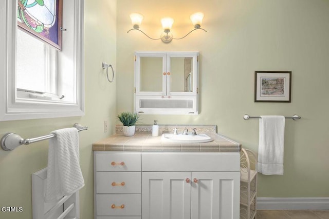 bathroom with tile patterned floors and vanity