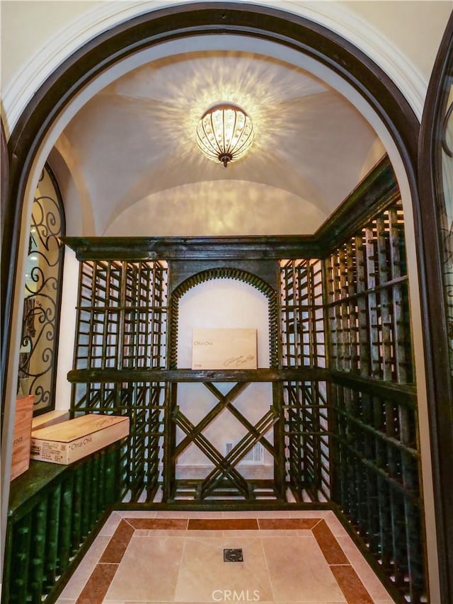 wine room featuring lofted ceiling