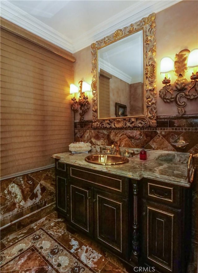 bathroom with tile walls, crown molding, and vanity