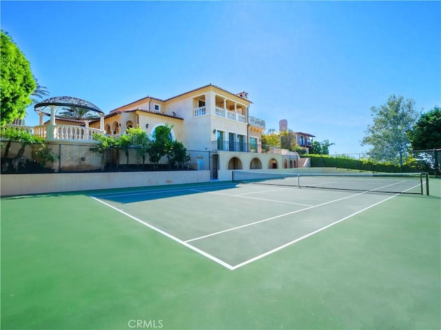 view of sport court with fence