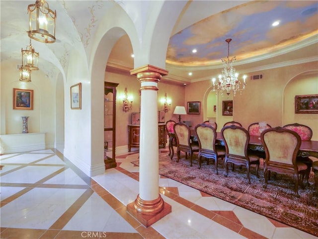 dining area with arched walkways, crown molding, a raised ceiling, visible vents, and baseboards