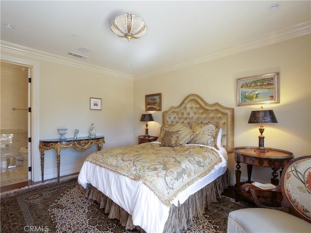 bedroom featuring ornamental molding, visible vents, and baseboards