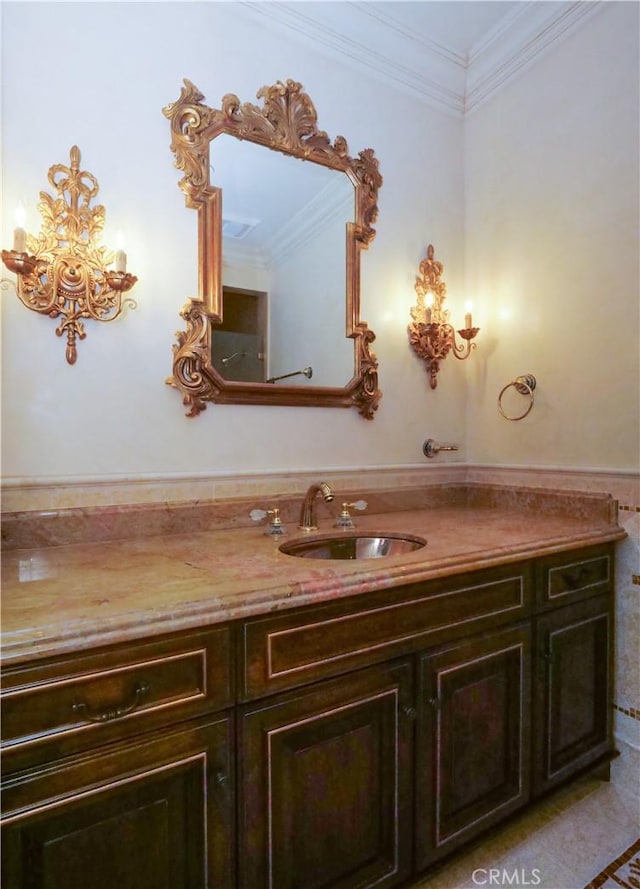 bathroom with visible vents, ornamental molding, and vanity