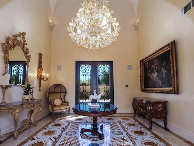 foyer entrance featuring french doors, a notable chandelier, visible vents, baseboards, and tile patterned floors