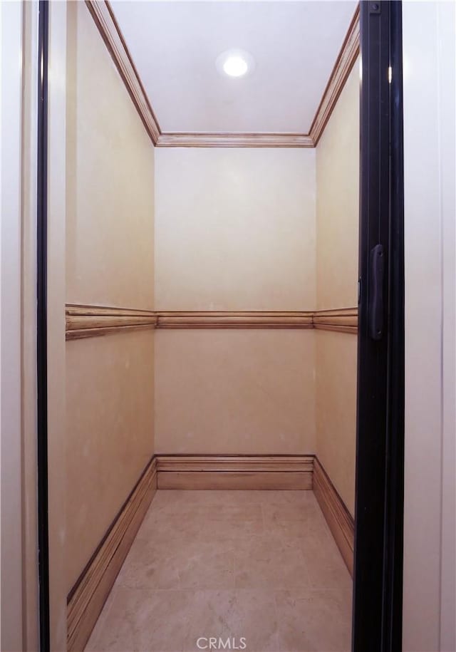 spacious closet featuring elevator