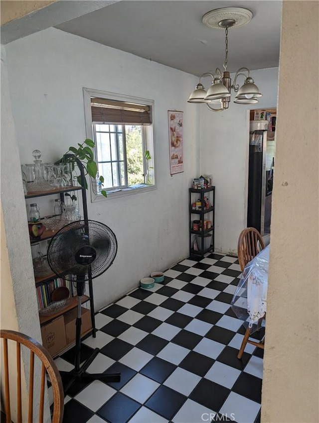 dining area featuring an inviting chandelier