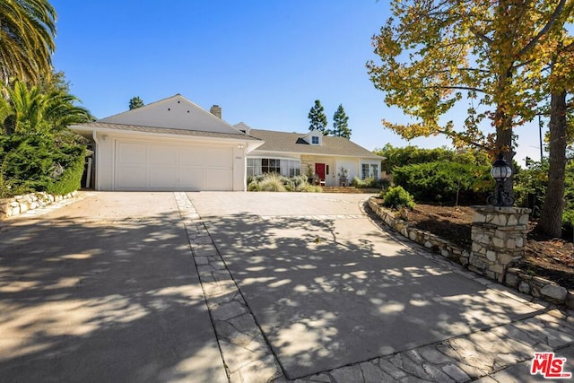 ranch-style home featuring a garage