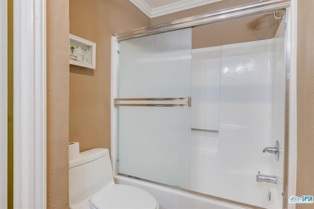 bathroom with toilet, combined bath / shower with glass door, and ornamental molding