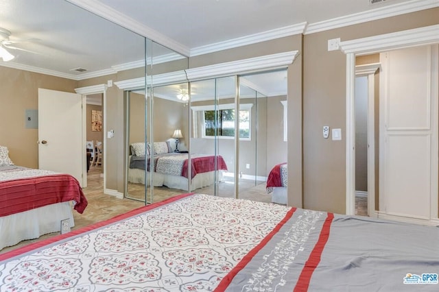 bedroom with a closet, ceiling fan, and crown molding