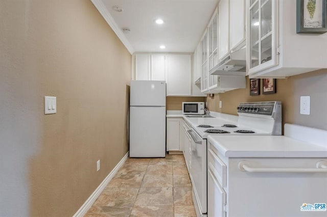 kitchen featuring crown molding, white cabinets, and white appliances