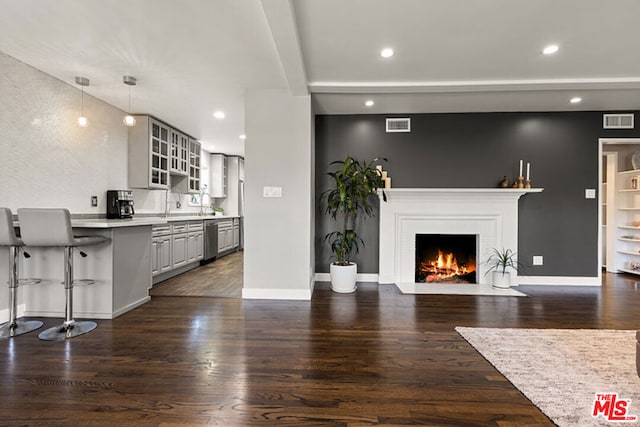 living room featuring dark hardwood / wood-style floors and a fireplace