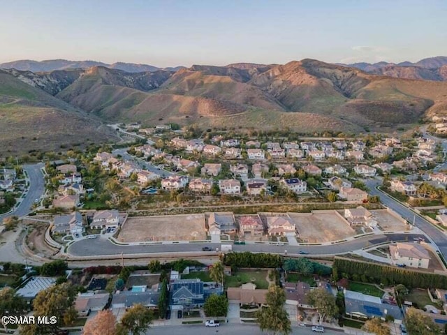 birds eye view of property with a mountain view