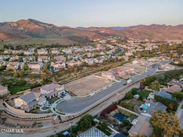 drone / aerial view featuring a mountain view