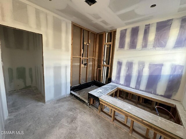 misc room with concrete flooring