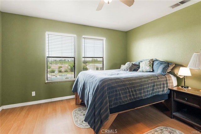 bedroom with ceiling fan and light hardwood / wood-style floors