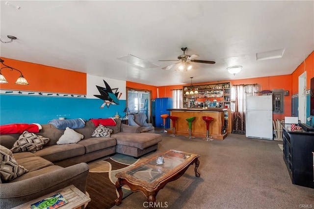 carpeted living room featuring bar and ceiling fan