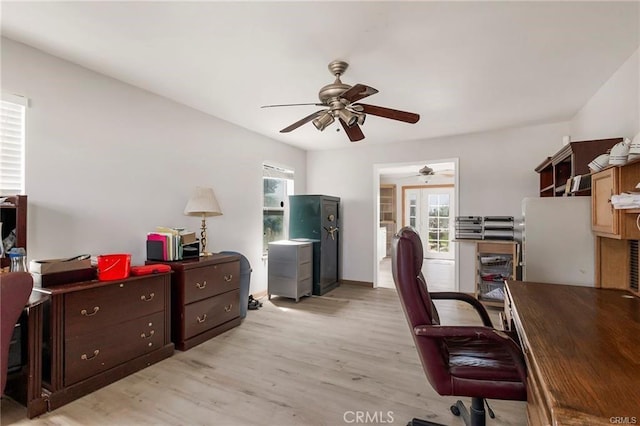 office area with french doors, light wood-type flooring, and ceiling fan