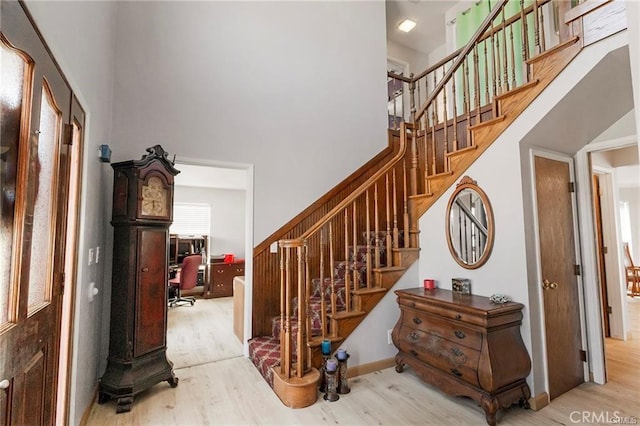 stairway featuring wood-type flooring