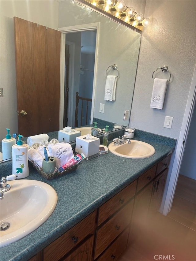 bathroom with tile patterned flooring and vanity