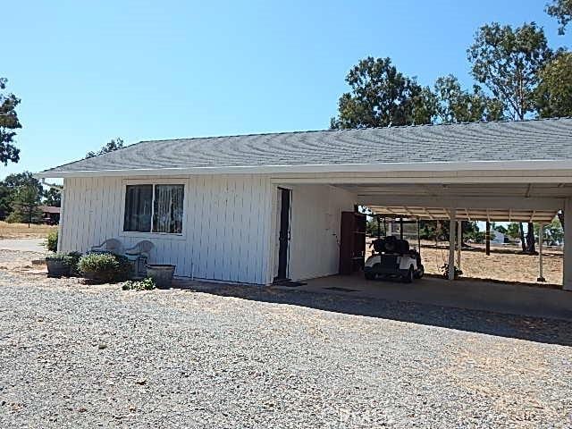 exterior space with a carport